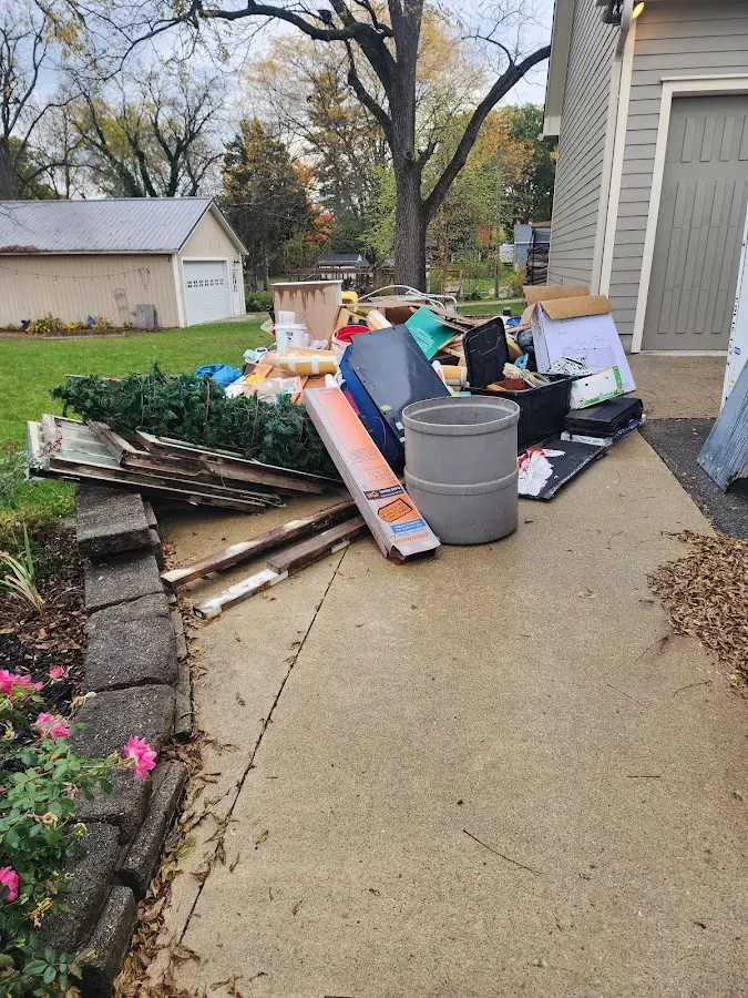 Dumpster being loaded with debris for Roofing Dumpster Rental in Nantucket